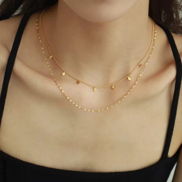 Collar inox doble dorado