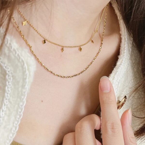 Collar inox doble dorado